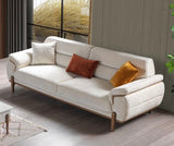 Beige sofa with decorative pillows in a living room setting